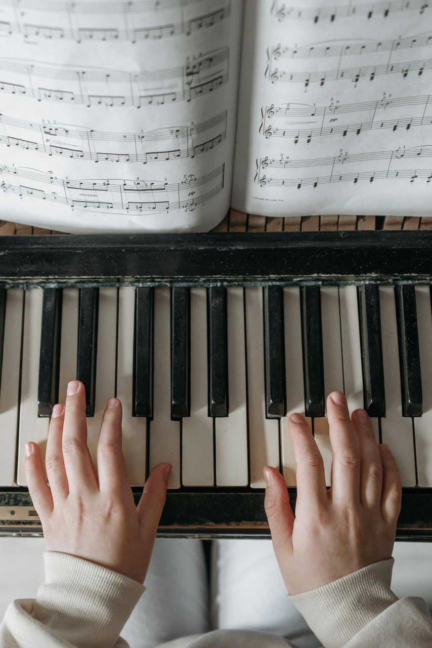 Hands playing piano